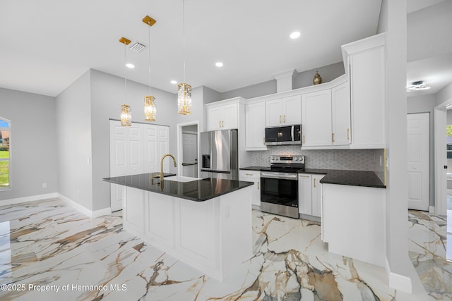 5317 Lydia Ct, Spring Hill, FL 34608 - kitchen with appliances with stainless steel finishes, dark countertops, light marble finish floors, white cabinets, and recessed lighting