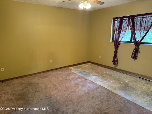 7239 Lykes Dublin Rd, Brooksville, FL 34601 - empty room with ceiling fan, a textured ceiling, unfinished concrete floors, and baseboards