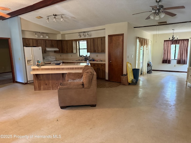 7239 Lykes Dublin Rd, Brooksville, FL 34601 - kitchen featuring white appliances, light countertops, a ceiling fan, a textured ceiling, and a center island