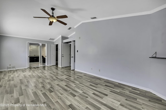 10277 Rosetti Ct, Spring Hill, FL 34608 - spare room featuring ceiling fan, lofted ceiling, baseboards, light wood-type flooring, and ornamental molding