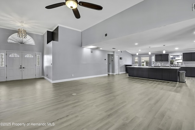 10277 Rosetti Ct, Spring Hill, FL 34608 - unfurnished living room featuring baseboards, a ceiling fan, recessed lighting, ornamental molding, and light wood finished floors