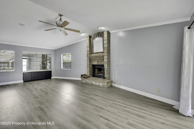 10277 Rosetti Ct, Spring Hill, FL 34608 - unfurnished living room with ceiling fan, ornamental molding, baseboards, vaulted ceiling, and a brick fireplace