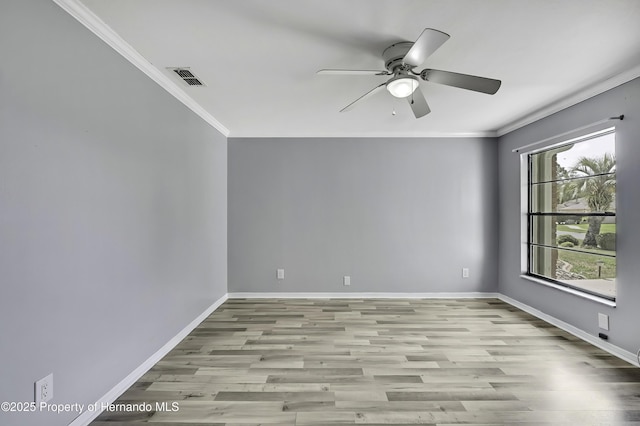 10277 Rosetti Ct, Spring Hill, FL 34608 - spare room with crown molding, ceiling fan, wood finished floors, and baseboards