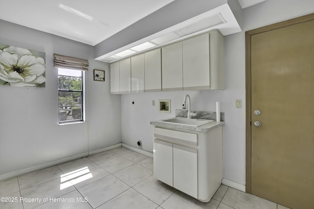 10277 Rosetti Ct, Spring Hill, FL 34608 - laundry area with electric dryer hookup, hookup for a washing machine, cabinet space, and baseboards