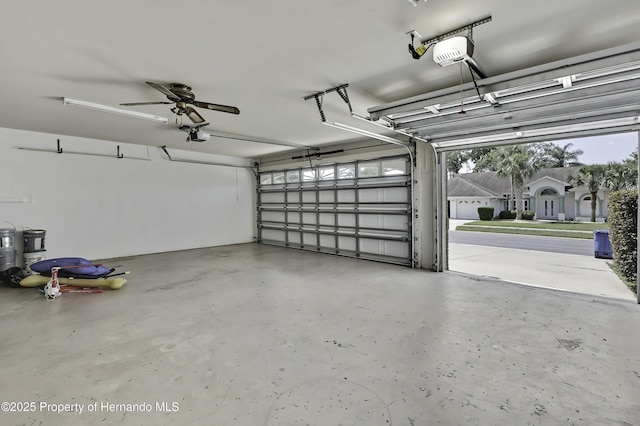 10277 Rosetti Ct, Spring Hill, FL 34608 - garage featuring a garage door opener and a ceiling fan