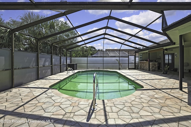 10277 Rosetti Ct, Spring Hill, FL 34608 - view of swimming pool featuring a patio area, a ceiling fan, and a lanai
