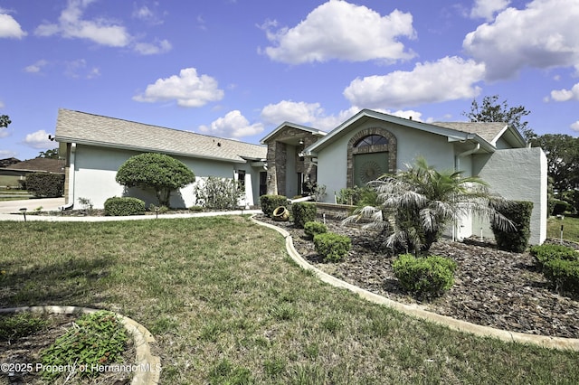 10277 Rosetti Ct, Spring Hill, FL 34608 - ranch-style house featuring stucco siding and a front yard