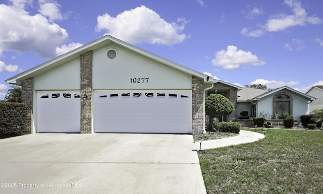10277 Rosetti Ct, Spring Hill, FL 34608 - ranch-style home featuring an attached garage, concrete driveway, and stucco siding