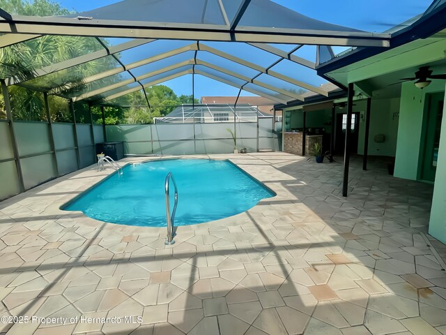10277 Rosetti Ct, Spring Hill, FL 34608 - view of swimming pool featuring a patio, a lanai, a fenced backyard, and a ceiling fan