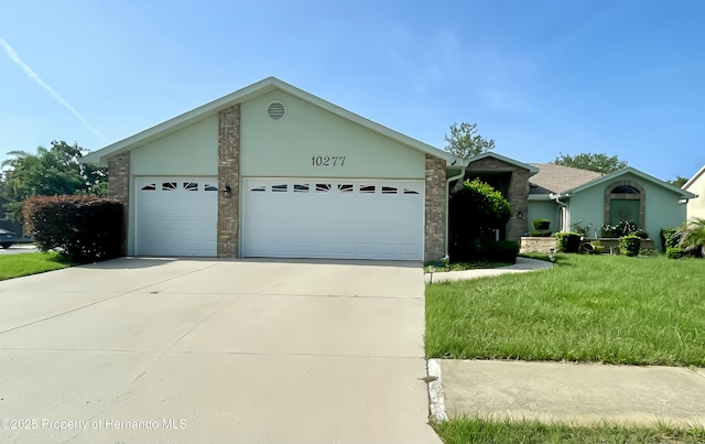 10277 Rosetti Ct, Spring Hill, FL 34608 - view of front facade with a garage, driveway, and a front lawn