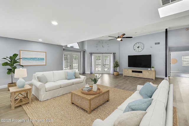 10277 Rosetti Ct, Spring Hill, FL 34608 - living area with wood finished floors, recessed lighting, a ceiling fan, a high ceiling, and french doors