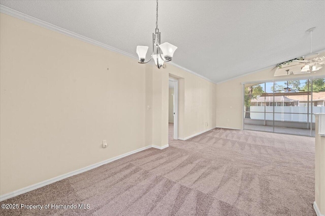 13491 Coronado Dr, Spring Hill, FL 34609 - spare room featuring a textured ceiling, a chandelier, carpet flooring, lofted ceiling, and ornamental molding