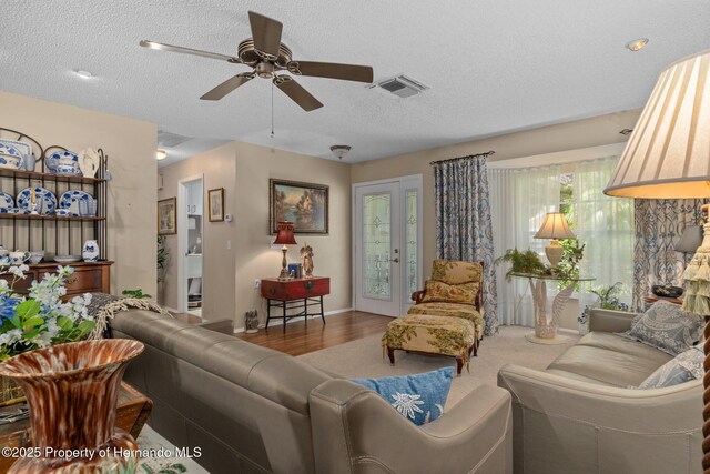 2486 Deer Trail Ln, Spring Hill, FL 34606 - living room featuring ceiling fan, wood finished floors, a textured ceiling, and baseboards