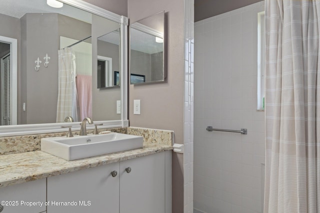 2486 Deer Trail Ln, Spring Hill, FL 34606 - bathroom featuring vanity and tiled shower