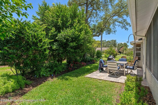 2486 Deer Trail Ln, Spring Hill, FL 34606 - view of grassy yard with a patio