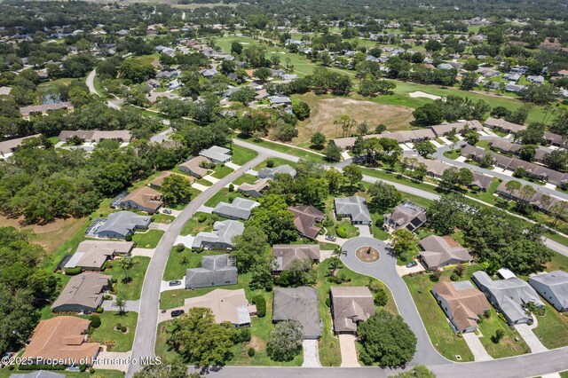 2486 Deer Trail Ln, Spring Hill, FL 34606 - aerial overview of property's location with nearby suburban area