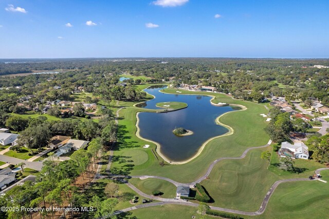 2486 Deer Trail Ln, Spring Hill, FL 34606 - aerial view of property's location featuring nearby suburban area, a large body of water, and a golf course