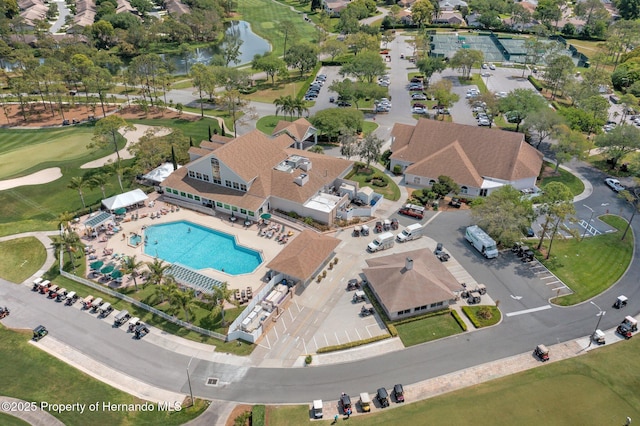 2486 Deer Trail Ln, Spring Hill, FL 34606 - aerial overview of property's location featuring a pool area, a large body of water, and a local golf course