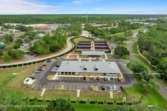 2486 Deer Trail Ln, Spring Hill, FL 34606 - aerial view of property's location featuring a heavily wooded area