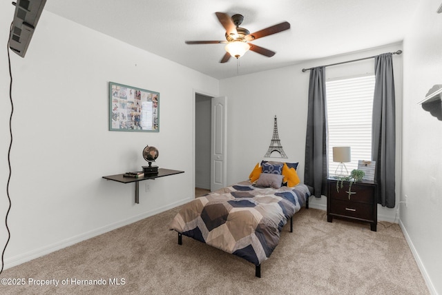 10094 Bankston Dr, Hudson, FL 34667 - bedroom with light carpet, baseboards, and a ceiling fan