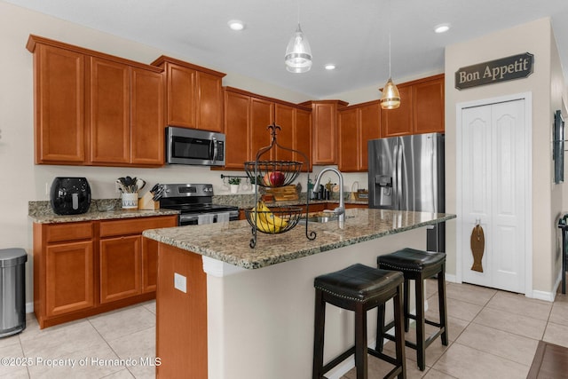 10094 Bankston Dr, Hudson, FL 34667 - kitchen featuring stainless steel appliances, stone counters, light tile patterned floors, and recessed lighting