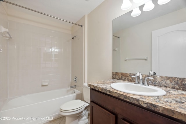 18710 Dobson Dr, Hudson, FL 34667 - bathroom featuring vanity, bathing tub / shower combination, toilet, and tile patterned floors