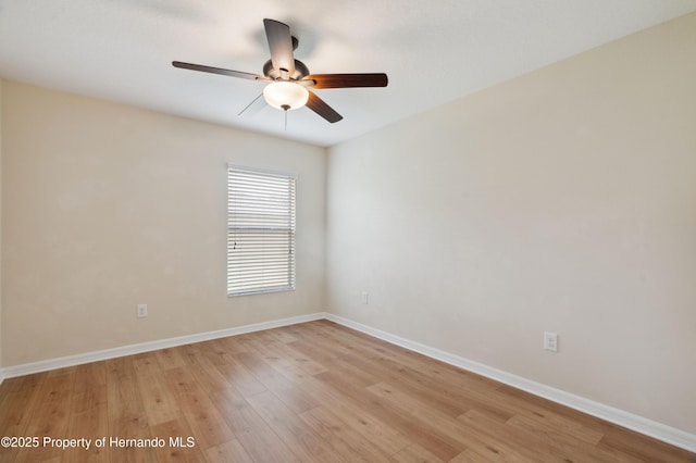 18710 Dobson Dr, Hudson, FL 34667 - spare room with ceiling fan, light wood-style flooring, and baseboards