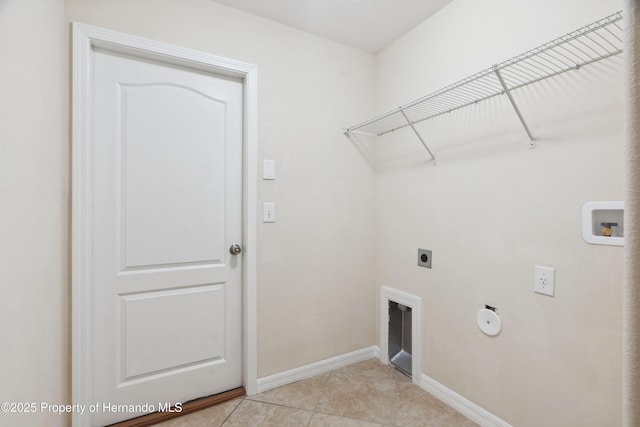 18710 Dobson Dr, Hudson, FL 34667 - laundry area with hookup for an electric dryer, hookup for a washing machine, baseboards, light tile patterned floors, and hookup for a gas dryer