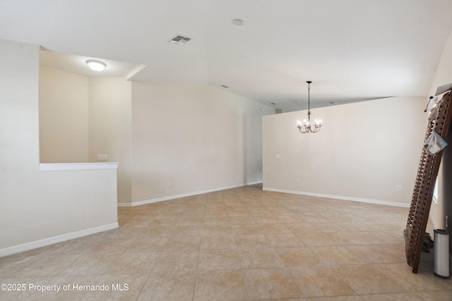18710 Dobson Dr, Hudson, FL 34667 - tiled spare room with lofted ceiling, a chandelier, and baseboards