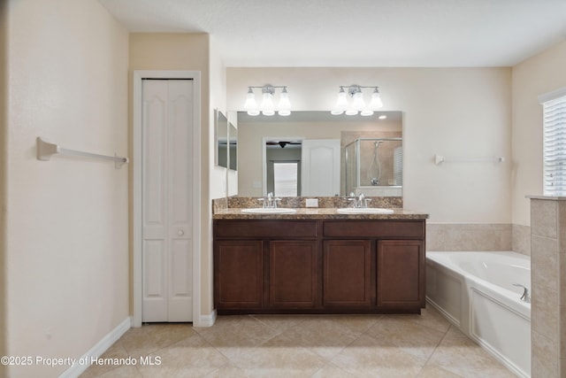 18710 Dobson Dr, Hudson, FL 34667 - bathroom featuring a closet, a shower stall, a bath, and double vanity