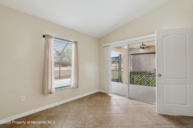 18710 Dobson Dr, Hudson, FL 34667 - unfurnished room featuring vaulted ceiling, light tile patterned floors, ceiling fan, and baseboards