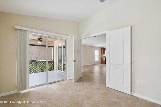 18710 Dobson Dr, Hudson, FL 34667 - unfurnished room featuring light tile patterned floors, baseboards, and ceiling fan