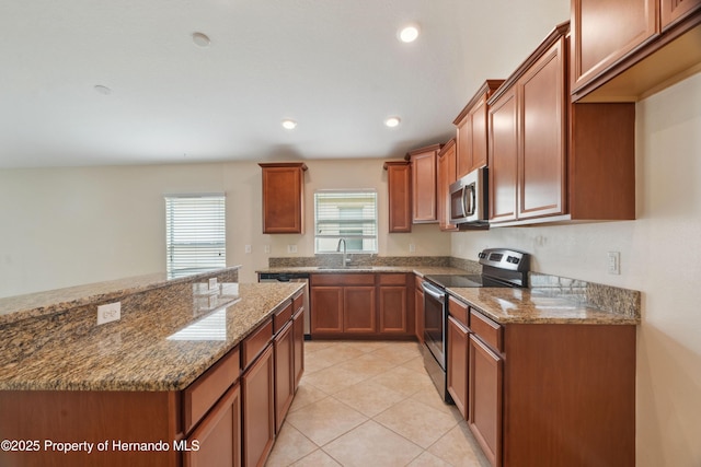 18710 Dobson Dr, Hudson, FL 34667 - kitchen with appliances with stainless steel finishes, a sink, plenty of natural light, stone countertops, and recessed lighting