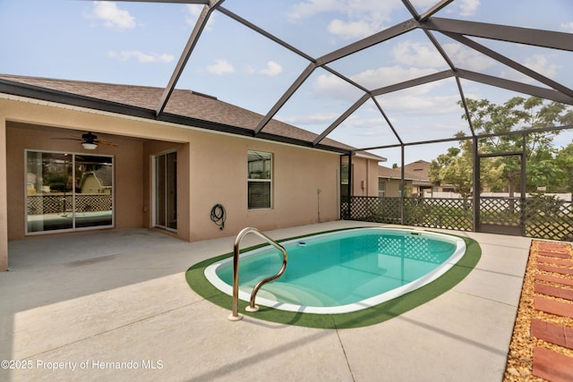 18710 Dobson Dr, Hudson, FL 34667 - outdoor pool featuring a patio area, a ceiling fan, and a lanai