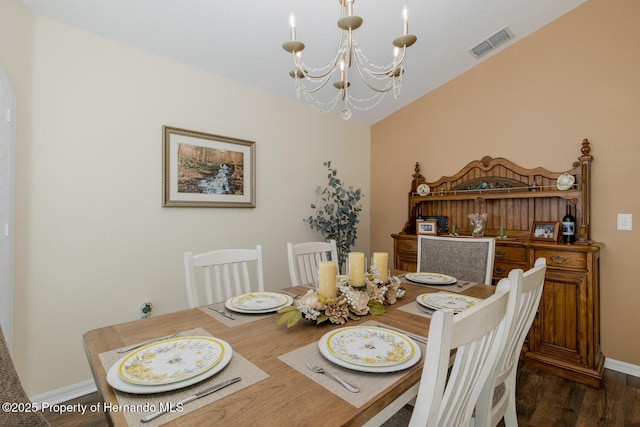 11404 Inman Ct, Spring Hill, FL 34609 - dining space with a chandelier, dark wood-style floors, and baseboards