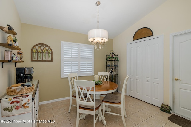 11404 Inman Ct, Spring Hill, FL 34609 - dining room with a chandelier, light tile patterned floors, and baseboards