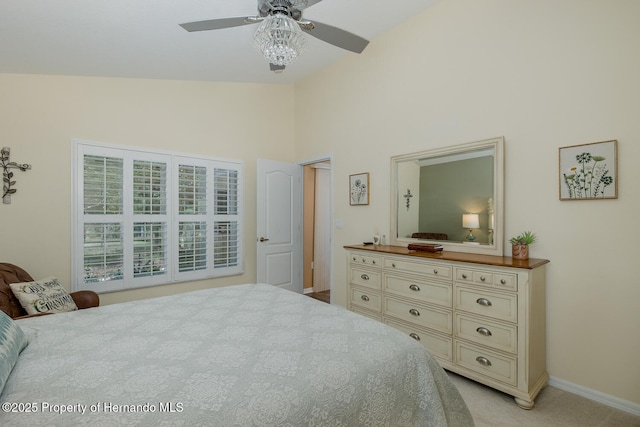 11404 Inman Ct, Spring Hill, FL 34609 - bedroom featuring baseboards, light carpet, high vaulted ceiling, and a ceiling fan