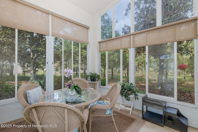 11404 Inman Ct, Spring Hill, FL 34609 - sunroom / solarium with healthy amount of natural light and outdoor dining space