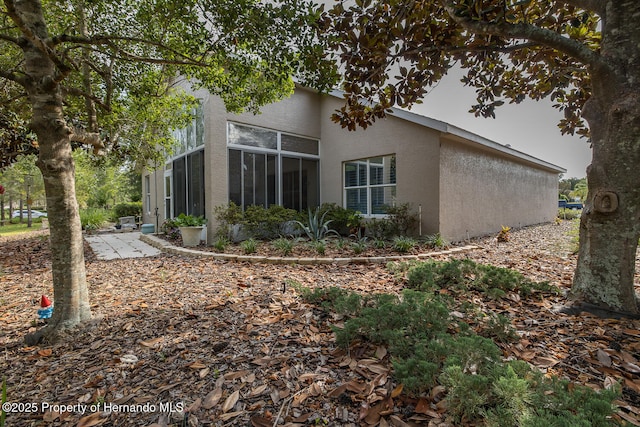 11404 Inman Ct, Spring Hill, FL 34609 - back of property with stucco siding