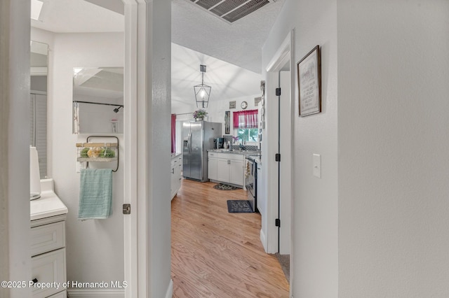 11226 Murraysville Dr, Spring Hill, FL 34609 - hall with light wood-style flooring