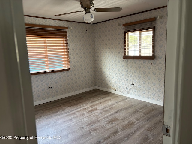 12325 Fairway Ave, Brooksville, FL 34613 - spare room with ornamental molding, wood finished floors, and a ceiling fan