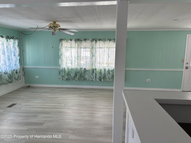12325 Fairway Ave, Brooksville, FL 34613 - empty room featuring ceiling fan and wood finished floors