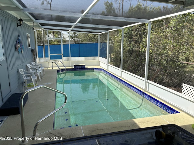 12325 Fairway Ave, Brooksville, FL 34613 - outdoor pool with glass enclosure and a patio area