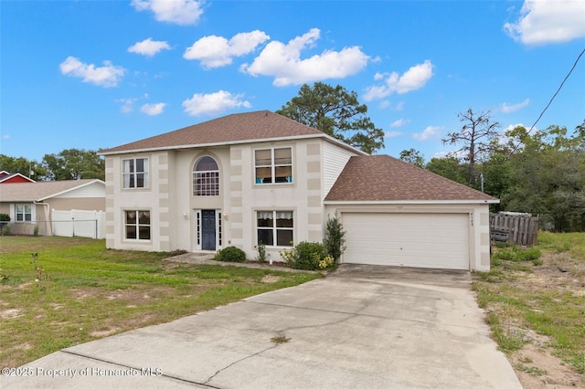 4148 Landover Blvd, Spring Hill, FL 34609 - view of front of home featuring an attached garage, roof with shingles, driveway, and stucco siding