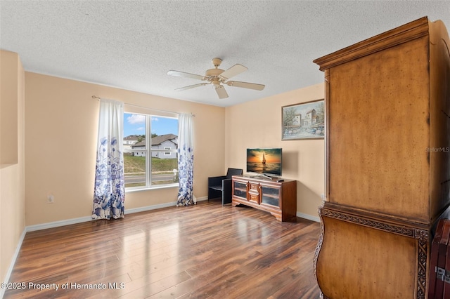 4148 Landover Blvd, Spring Hill, FL 34609 - living room featuring wood finished floors, ceiling fan, a textured ceiling, and baseboards