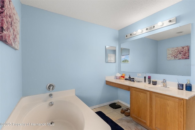 4148 Landover Blvd, Spring Hill, FL 34609 - full bath with a garden tub, vanity, tile patterned floors, and a textured ceiling