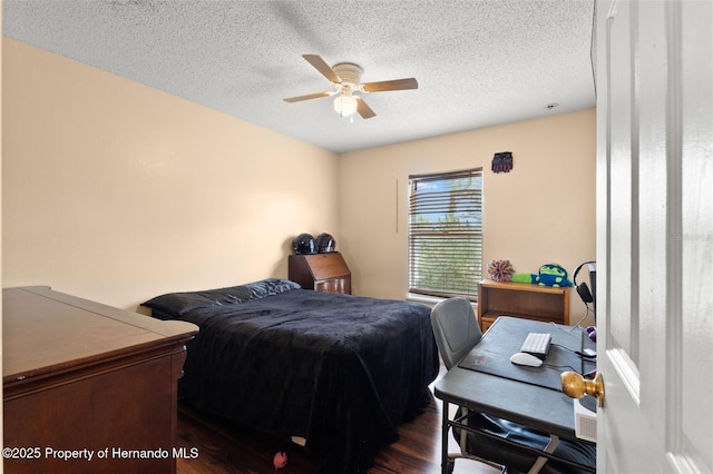 4148 Landover Blvd, Spring Hill, FL 34609 - bedroom featuring dark wood-style flooring, a textured ceiling, and ceiling fan