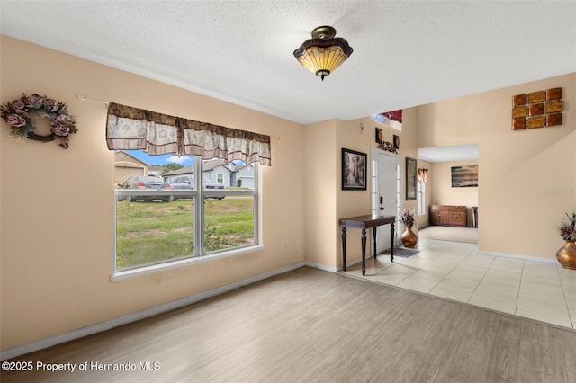4148 Landover Blvd, Spring Hill, FL 34609 - dining room with wood finished floors, a textured ceiling, and baseboards