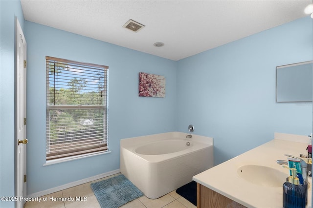 4148 Landover Blvd, Spring Hill, FL 34609 - full bath with vanity, a bath, tile patterned flooring, and baseboards