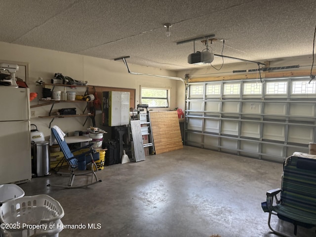 11087 Addison St, Spring Hill, FL 34609 - garage featuring freestanding refrigerator and a garage door opener